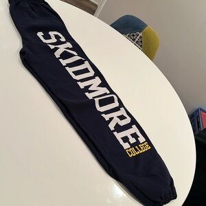 Navy blue Skidmore College sweatpants with elastic waist and ankle